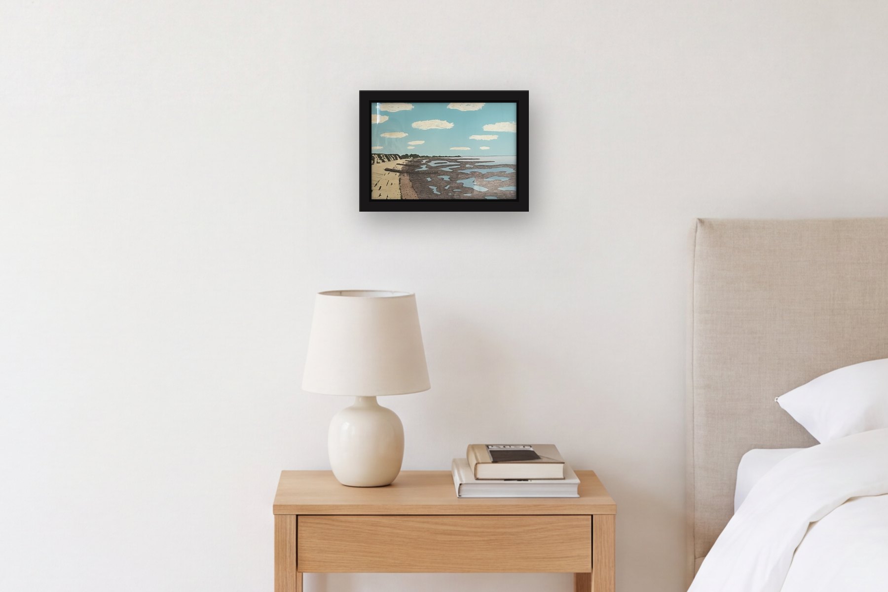 Brewster Beach Day by Bill Sullivan, hanging above a bedside table in a bedroom