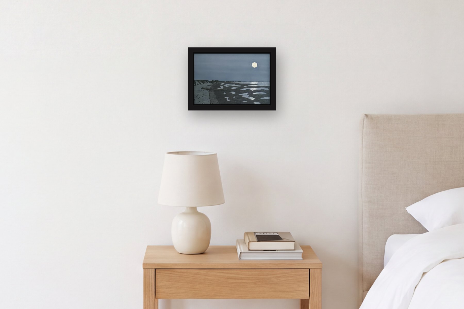 Brewster Beach Night by Bill Sullivan, hanging above a bedside table in a bedroom