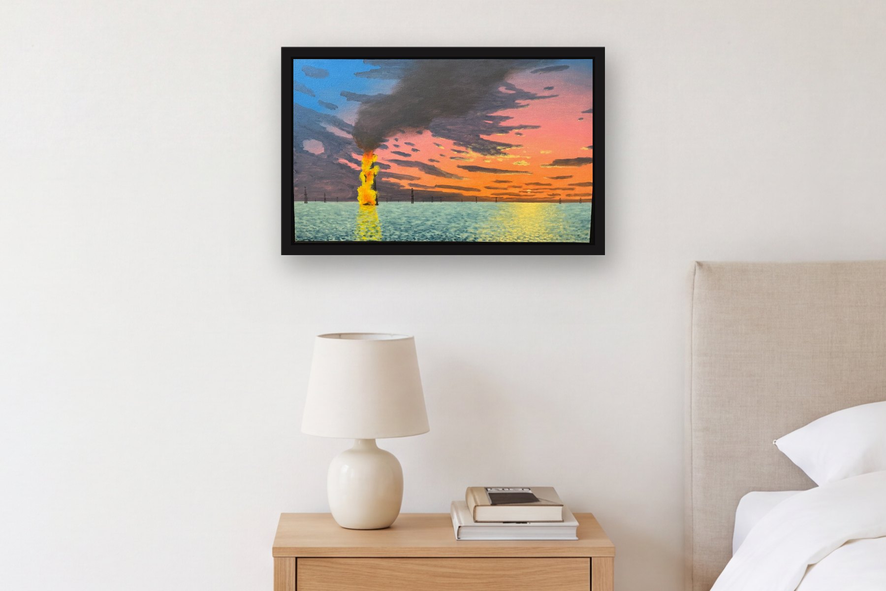 Burning Oil Well in Lake Maracaibo by Bill Sullivan, hanging above a bedside table in a bedroom
