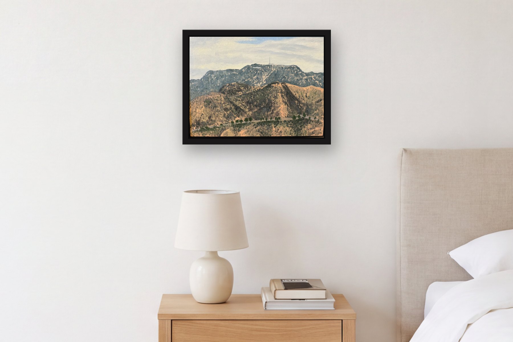 Hollywood by Bill Sullivan, hanging above a bedside table in a bedroom