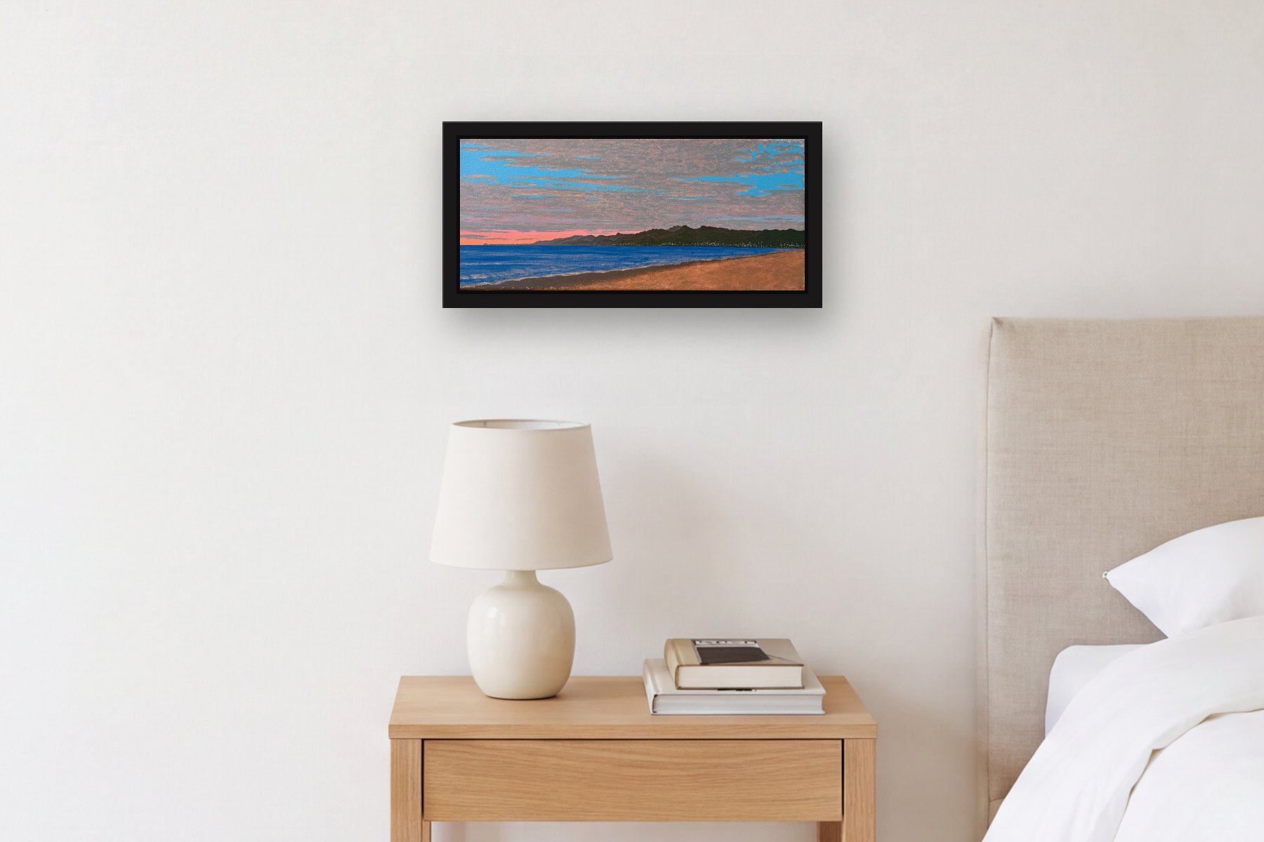 Santa Monica by Bill Sullivan, hanging above a bedside table in a bedroom