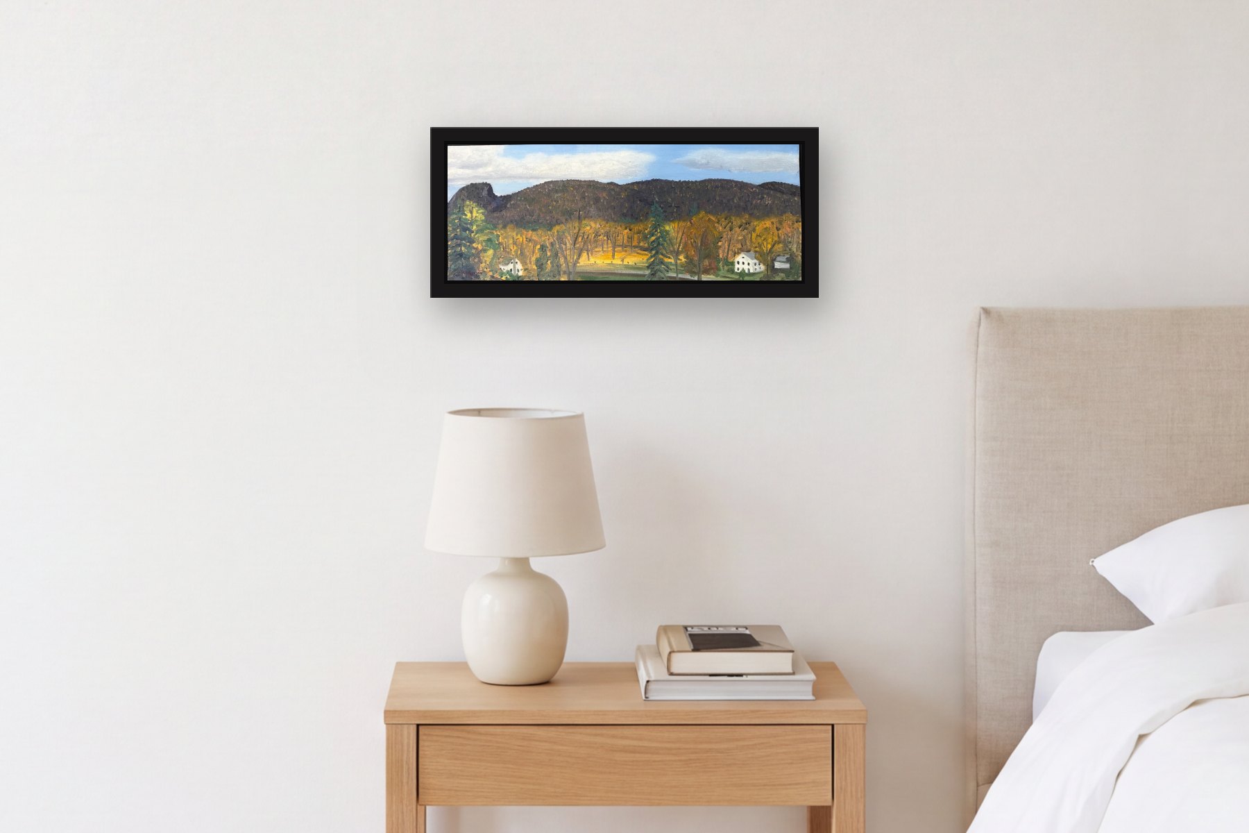 Sleeping Giant by Bill Sullivan, hanging above a bedside table in a bedroom
