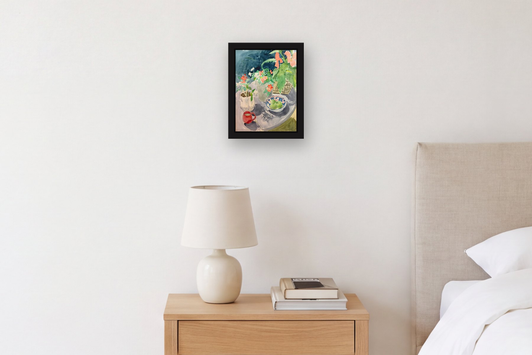 Still Life by Nancy Beal, hanging above a bedside table in a bedroom