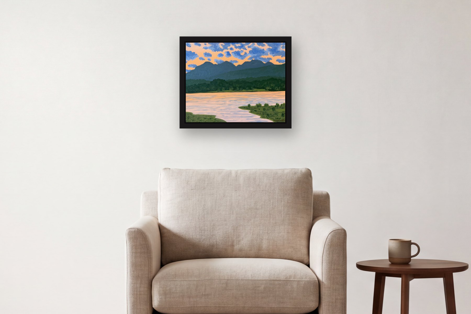 The Catskills from Hudson at Twilight by Bill Sullivan, hanging above an armchair