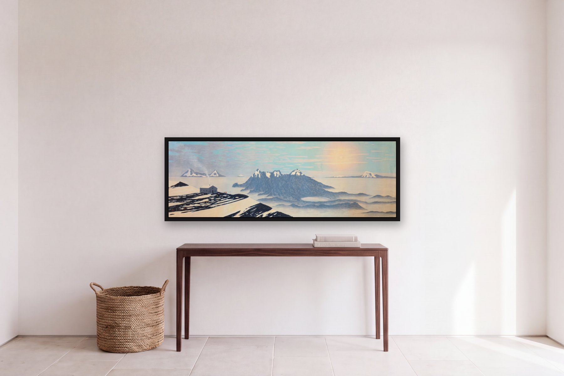 A View of the Ilinizas from Cotopaxi by Bill Sullivan, hanging above a console table in a hallway