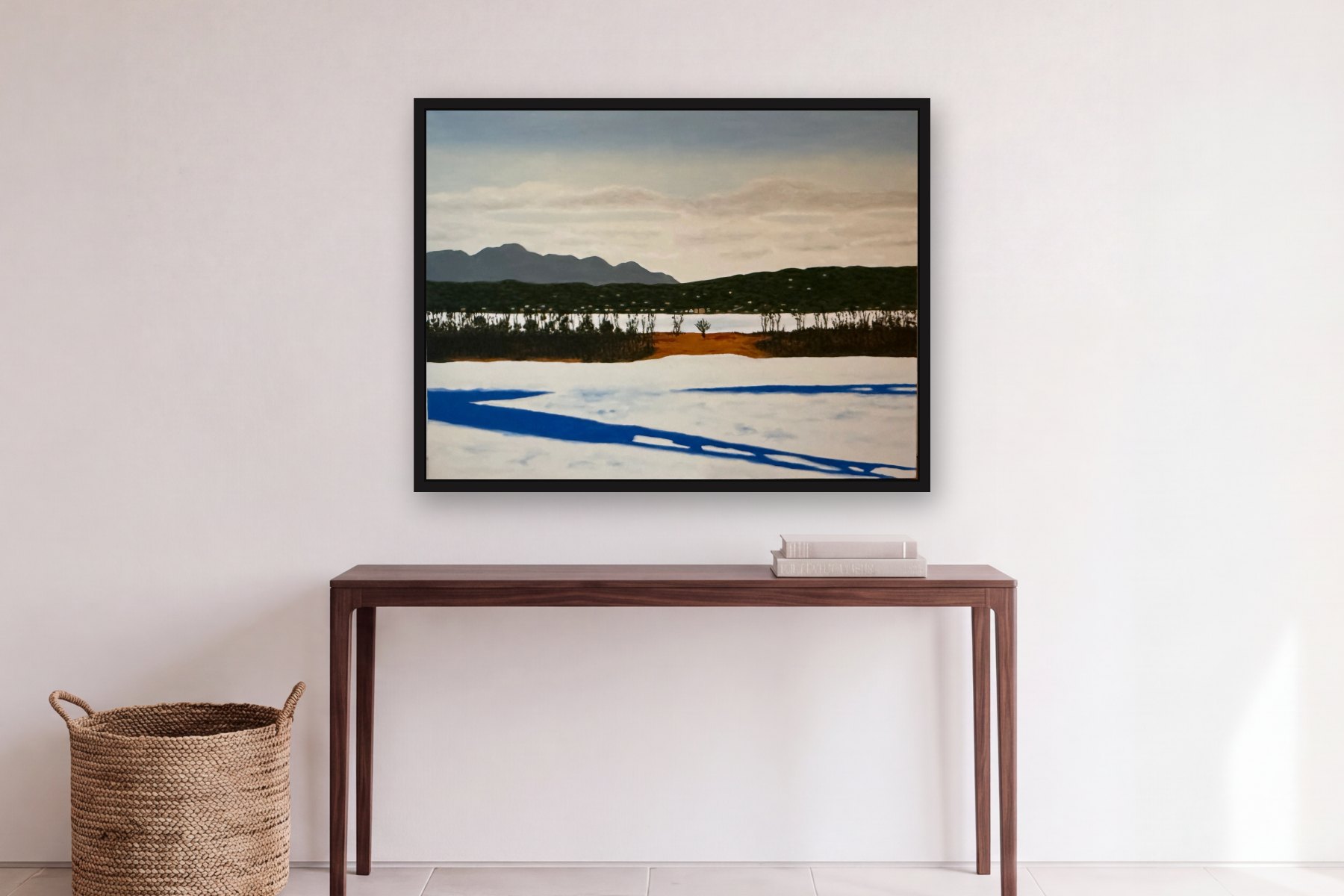 Athens from Hudson in Winter by Bill Sullivan, hanging above a console table in a hallway