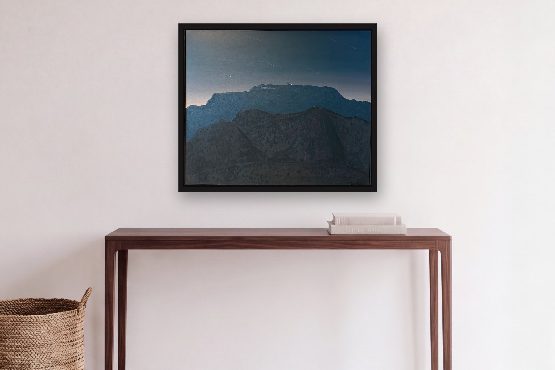 Hollywood by Bill Sullivan, hanging above a console table in a hallway