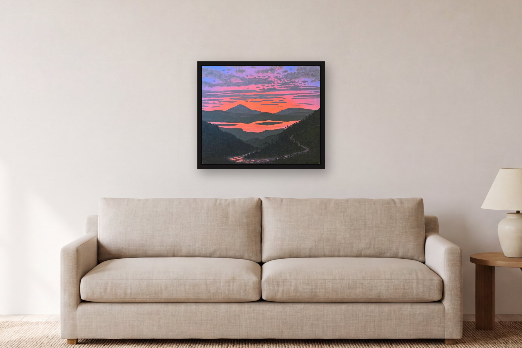 Mountain and River by Bill Sullivan, hanging above a sofa in a living room