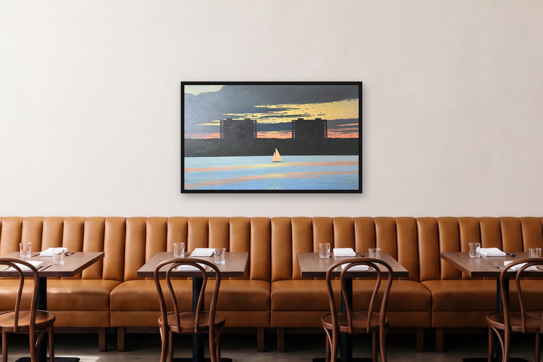 New Jersey Skyline from Manhattan by Bill Sullivan, hanging above a banquette in a restaurant