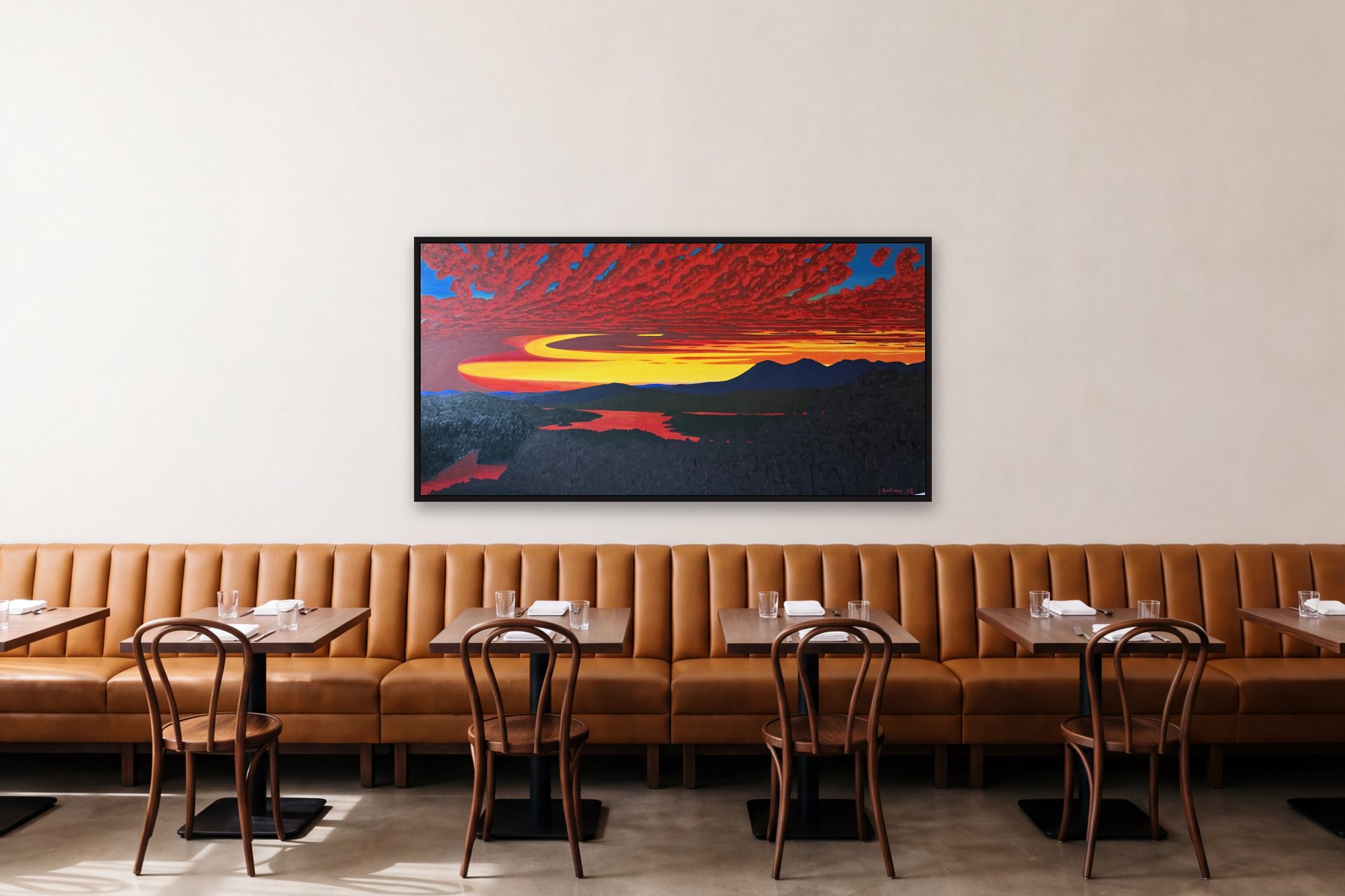 Olana Twilight II by Bill Sullivan, hanging above a banquette in a restaurant