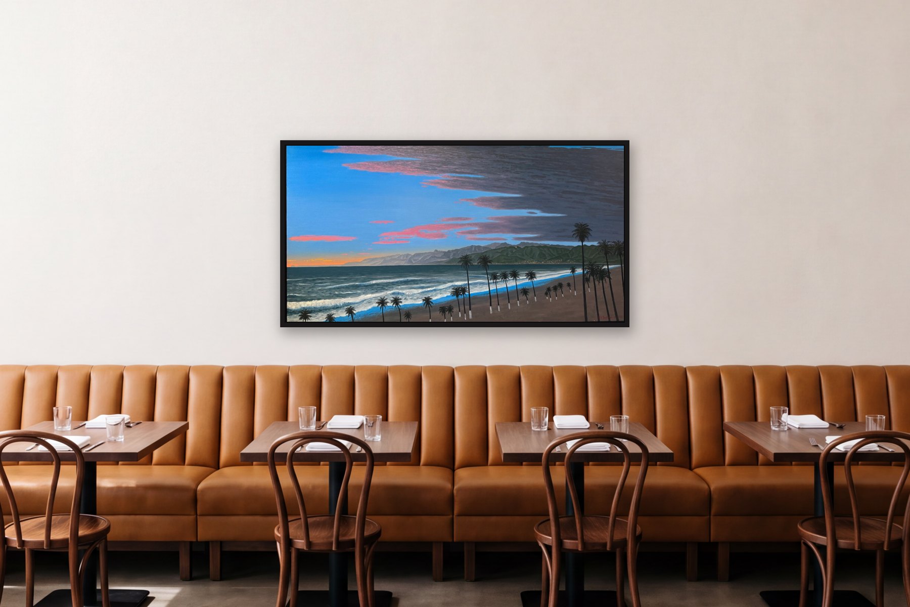 Santa Monica Bay from Venice by Bill Sullivan, hanging above a banquette in a restaurant